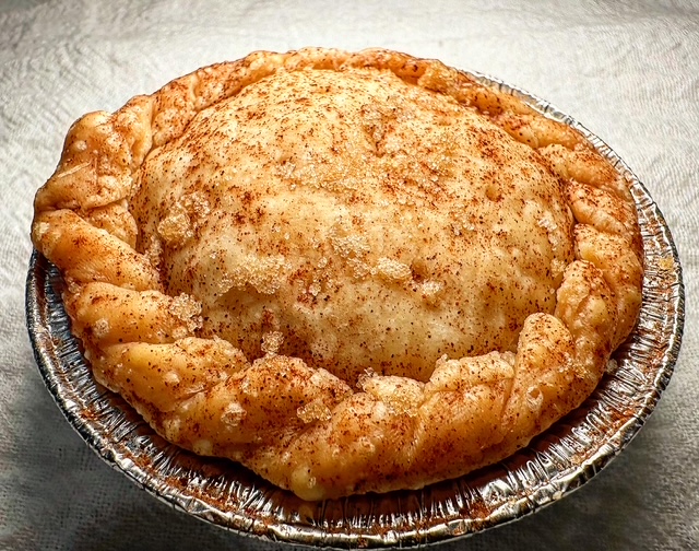 Justin Jones makes the fillings for Sweet Daddy's Sweet Potato Pies desserts and his wife, Charity, makes the pie crusts. This is a photo of their apple pie. (Photo by Chanda Temple) 