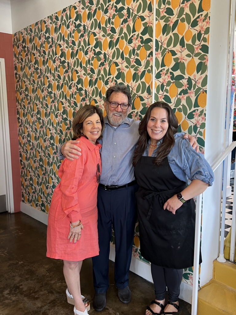 Mary and Paul Liollio with their daughter, Tina. Tina started Tina's Market in Homewood, AL in March 2024. (Photo provided by Tina Liollio.)